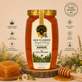 A jar of Mix Flower Jungle Honey from Honey Mecca is displayed on a wooden slice with a honeycomb piece and a wooden honey dipper. The background is a soft beige with decorative wildflowers, and the image includes text callouts highlighting product features like 'Sourced from forest trees' and 'Raw & Unprocessed'.