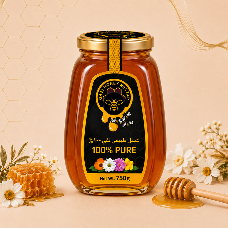 A glass jar of Cashmere Honey centered on a warm beige background, surrounded by decorative flowers, a honeycomb piece, a wooden honey dipper, and honey pooling at the base. The jar has a black label with gold and white text reading '100% PURE' and 'Cashmere Honey Market,' plus a gold lid.
